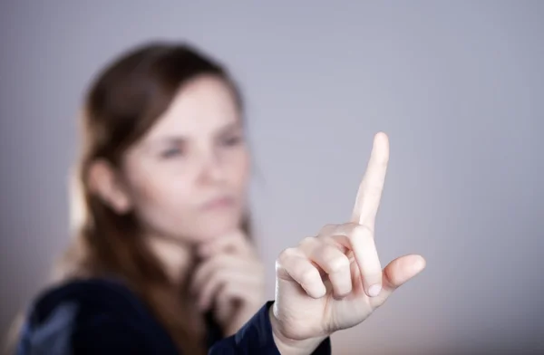 Рука жінки, один палець щось вказує — стокове фото
