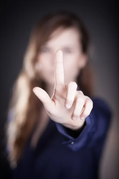 A mão da mulher, um dedo apontando algo — Fotografia de Stock