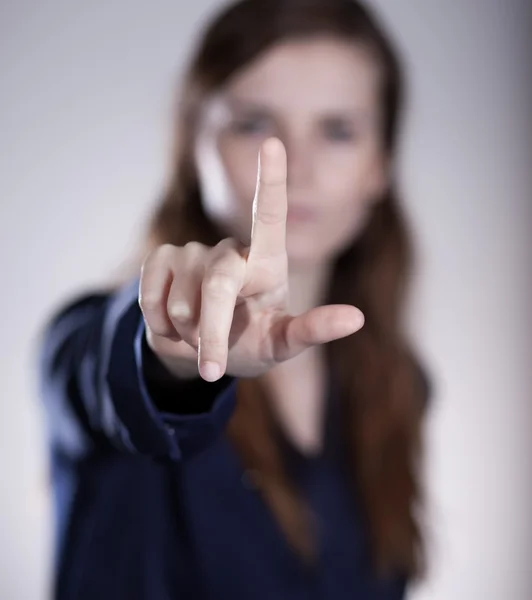 Woman's hand with finger, dark background — Stock Photo, Image