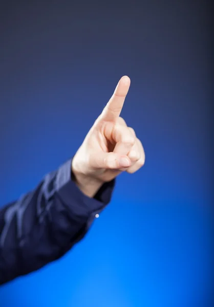 Woman's hand with finger, blue background — Stock Photo, Image