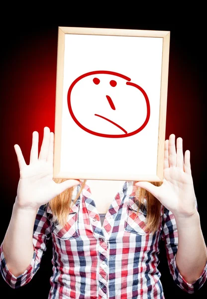 Woman showing unsure emoticon in front of face — Stock Photo, Image