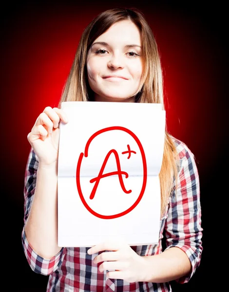 Perfect school grade A plus of exam and happy girl — Stock Photo, Image