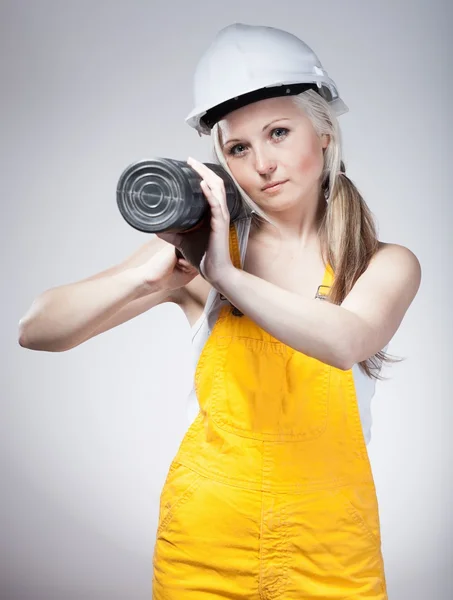 Young builder woman construction worker, blueprints plan — Stock Photo, Image
