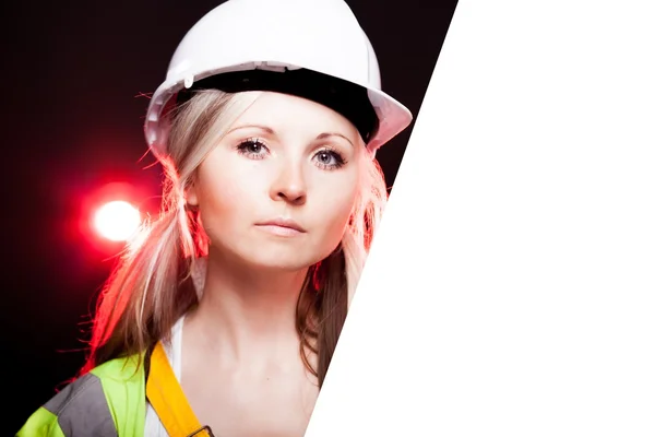 Young architect woman construction worker, empty poster — Stockfoto