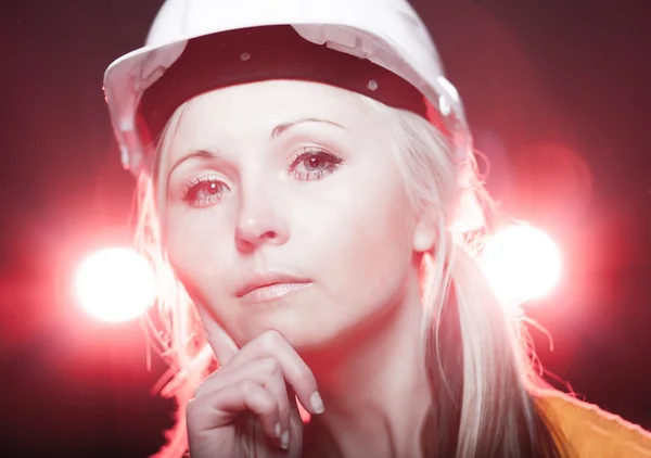 Young architect woman construction worker, glowing lights — Stock Photo, Image