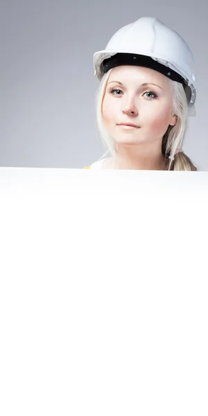 Young builder woman construction worker, empty poster — Stock Photo, Image