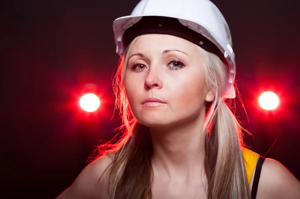 Young architect woman construction worker, glowing lights — 스톡 사진