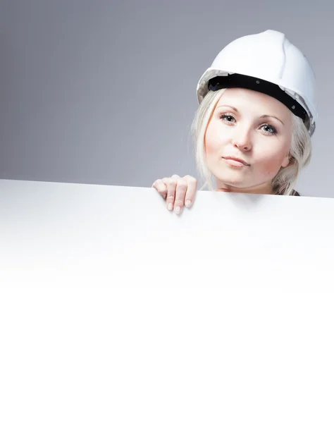 Young builder craftswoman construction worker, empty banner — 스톡 사진