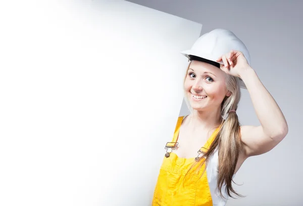 Young builder craftswoman construction worker, empty frame — Stock Photo, Image