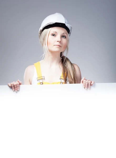 Young builder woman construction worker, empty frame — 스톡 사진