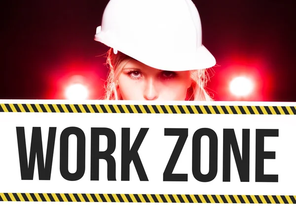 Worker holding work zone sign on information board — Stock Photo, Image