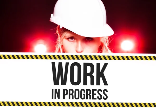 Worker holding work in progress sign on information board — Stock Photo, Image