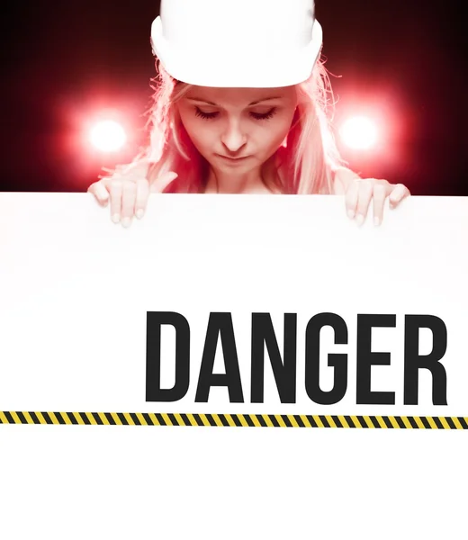 Caution sign held by worker — Stock Photo, Image