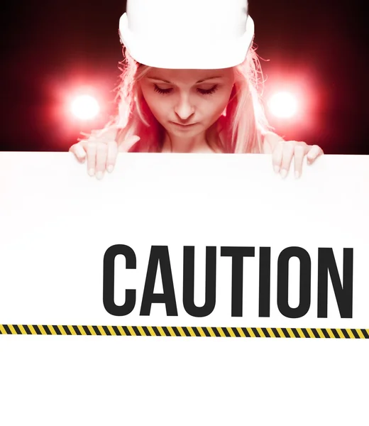 Caution sign held by worker — Stock Photo, Image