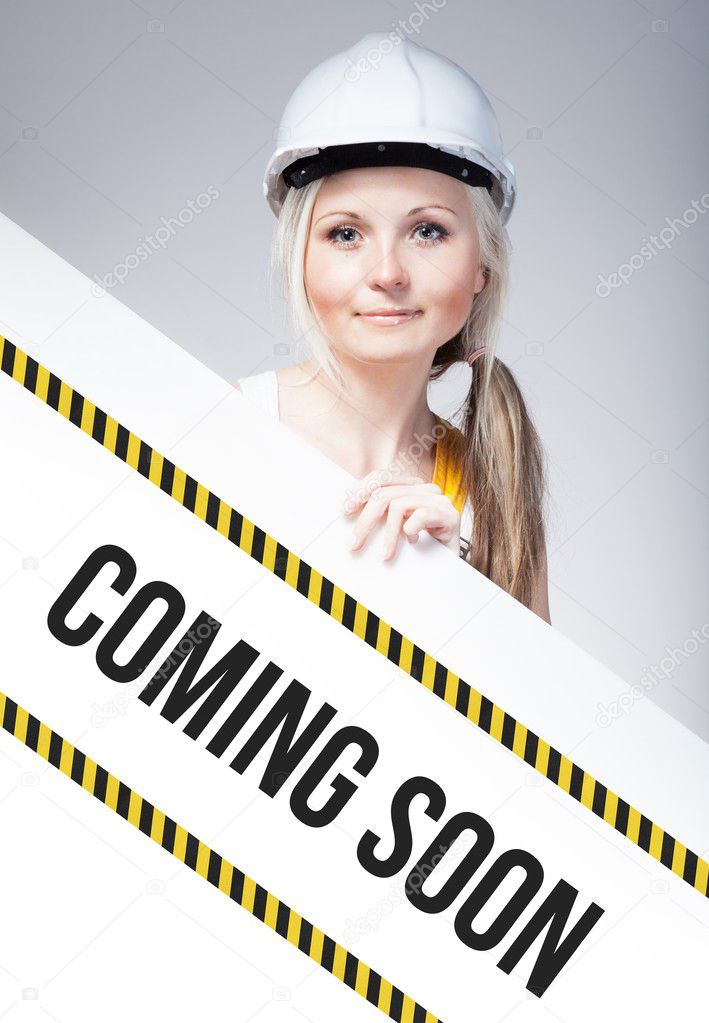 Coming soon sign placed on information board, worker woman