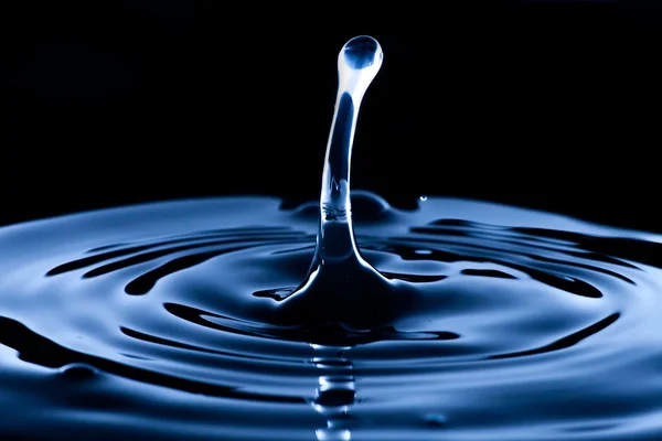 Water splash and drop, dark blue — Stock Photo, Image