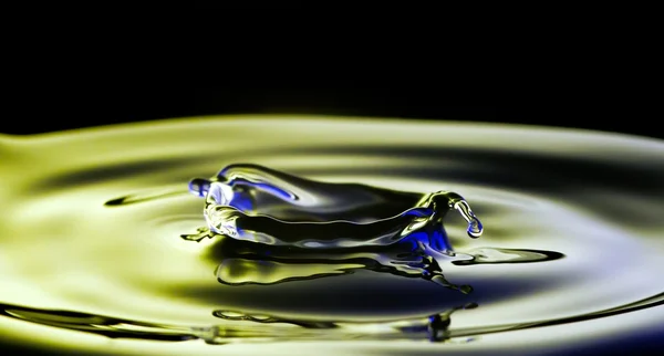 Water splash macro, colorful liquid — 图库照片