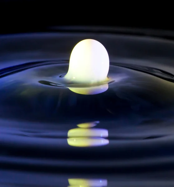 Milk splash in water, white liquid — Stock Photo, Image