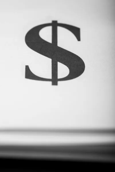 Close up too dollar sign on paper background typography — Stock Photo, Image