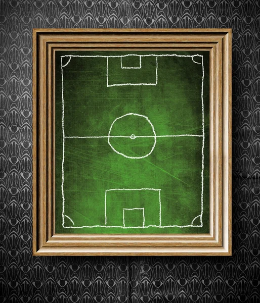 Soccer field symbol chalkboard in old wooden frame — Stock Photo, Image