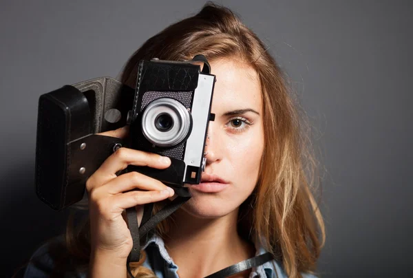 Young photographer taking pictures with old camera — Stock Photo, Image