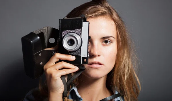 Photographer woman holding old camera, taking pictures — Stock Photo, Image