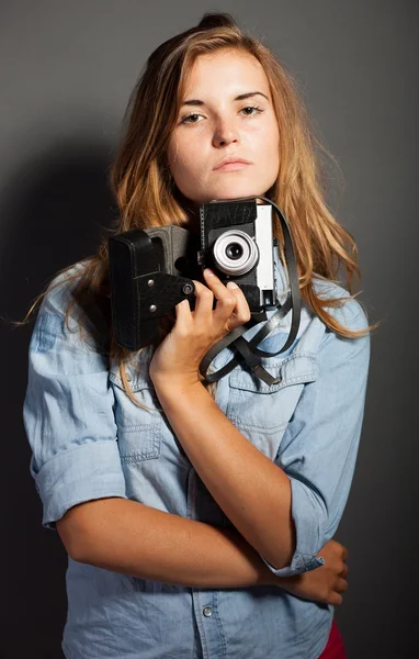 Sexy photographer woman with old camera — Stock Photo, Image