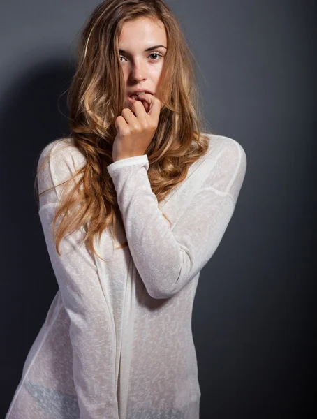 Sexy shy woman in long sleeve white t-shirt — Stock Photo, Image