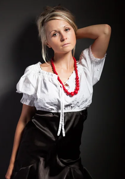 Folk woman in folklore clothes braiding a plait — Stock Photo, Image