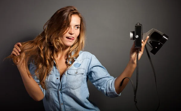 Silly photographer woman taking pictures herself old camera — Stock Photo, Image