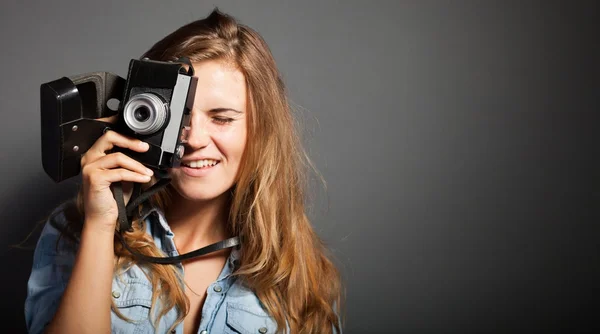 Smiling photographer woman taking pictures old camera — Stock Photo, Image