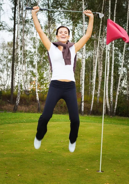 Dolblij en lachende vrouw golfspeler in winnaar pose — Stockfoto