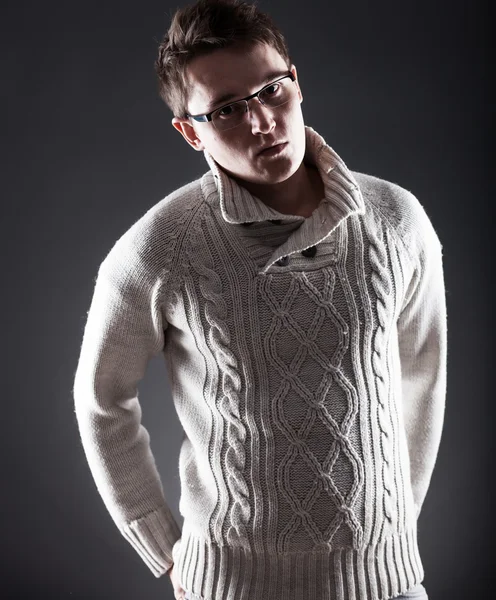 Young man in white sweater and glasses — Stock Photo, Image