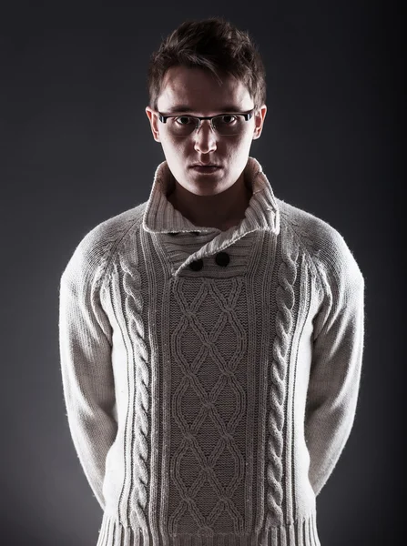 Young man in white sweater and glasses — Stock Photo, Image