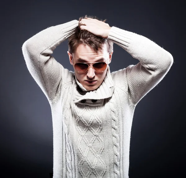 Man in white sweater and sunglasses — Stock Photo, Image