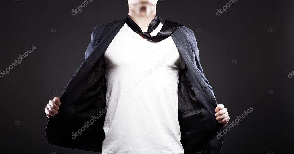 Man pulling open jacket showing white t shirt, copyspace