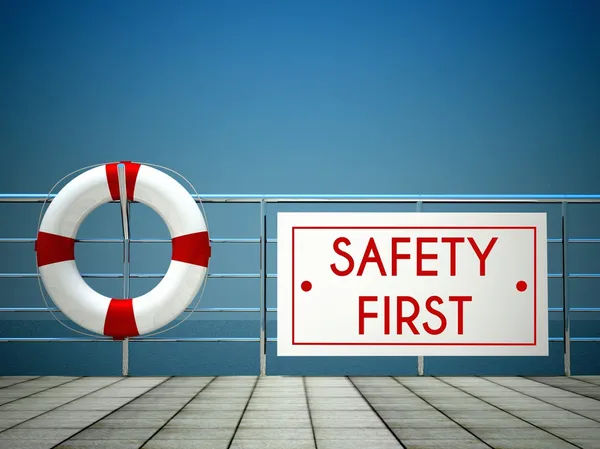 Safety First sign at the swimming pool, lifebuoy — Stock Photo, Image