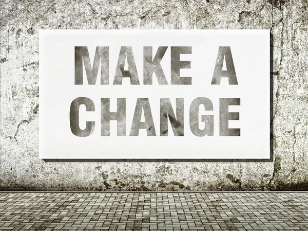 Faire un changement, mots sur mur — Photo