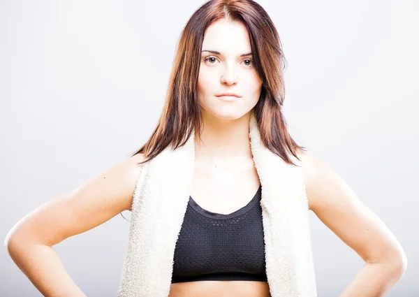 Young woman after training in sport bra with towel — Stock Photo, Image