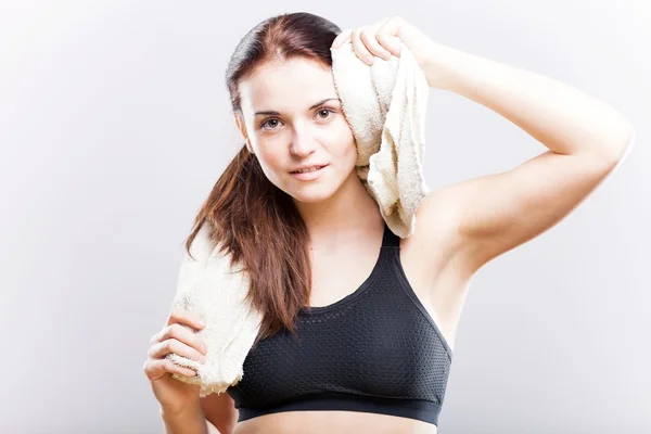 Tired woman after training and bath with towel — Stock Photo, Image