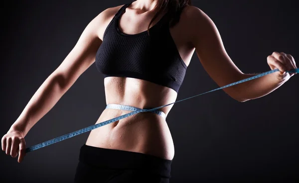 Fitness woman measuring her waist, weight loss — Stock Photo, Image