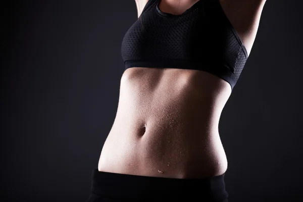 Woman wet sporty belly after exercise — Stock Photo, Image