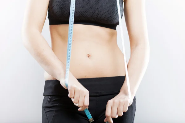 Woman belly and measuring tape, weight loss concept — Stock Photo, Image