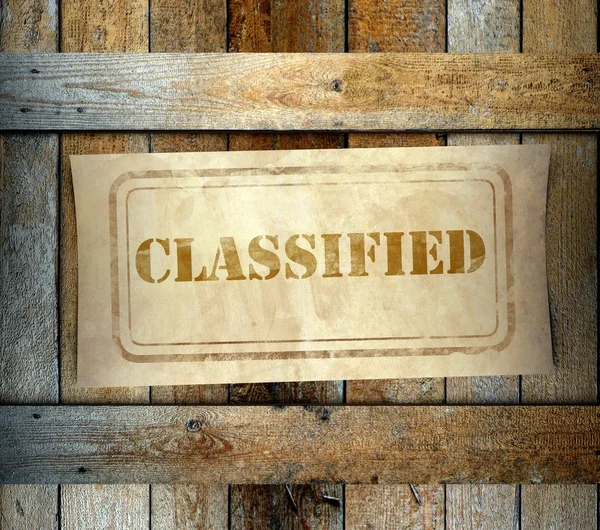 Razítko klasifikované štítek starý dřevěný box — Stock fotografie