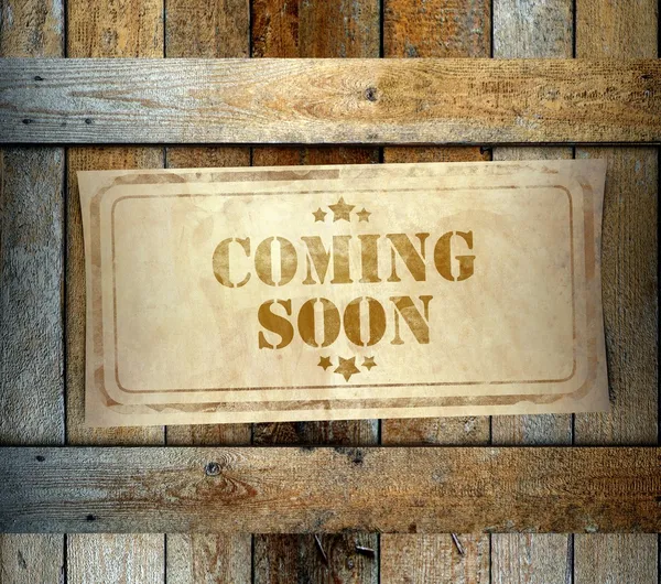 Stamp Coming Soon label old wooden box — Stock Photo, Image