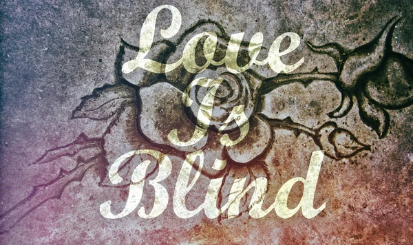 Love is Blind message stone rose background — Stock Photo, Image