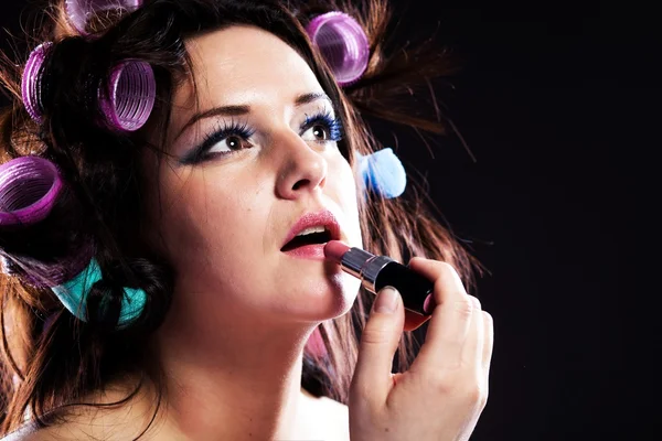 Woman makeup hair with curlers and lipstick — Stock Photo, Image