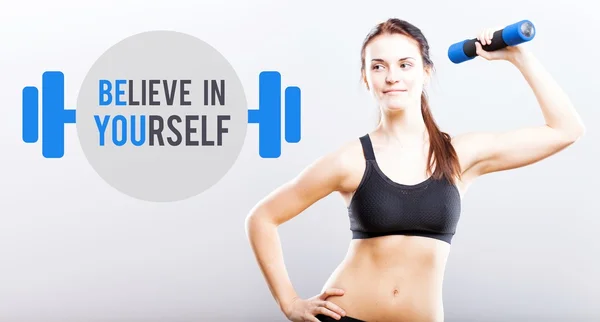 Believe in yourself slim woman with dumbbell — Stock Photo, Image