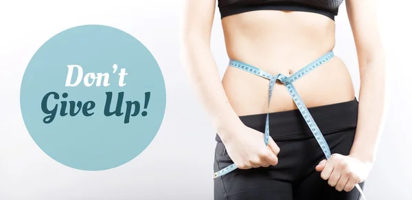 Dont give up, girl measuring her waist — Stock Photo, Image