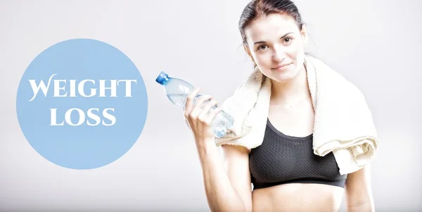 Weight loss, woman with bottle and towel — Stock Photo, Image